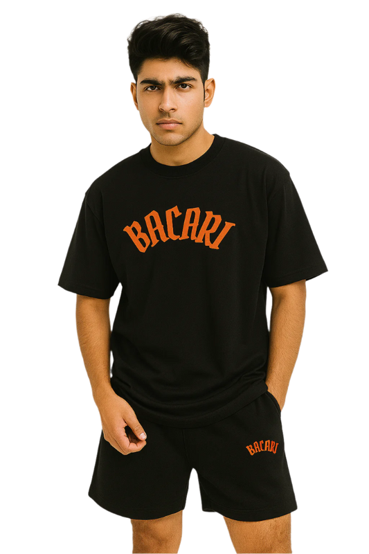 Person wearing a black t-shirt and shorts with 'Bacari' branding on a white background